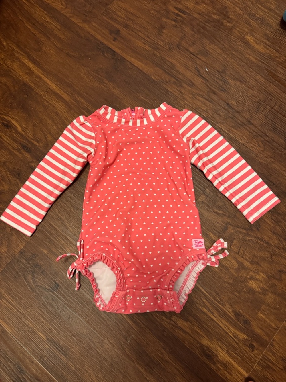Ruffle Butts Coral and White Heart Long-Sleeve One-Piece